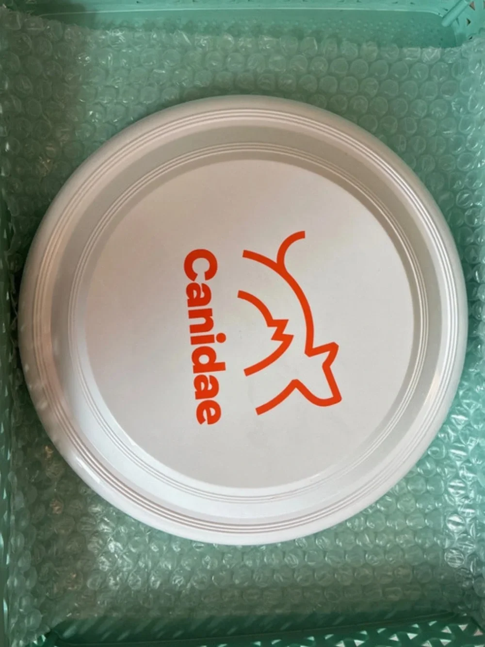 Frisbee Throwing Disc Toy White Orange Canidae Logo